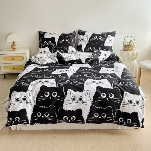Single 4-piece reversible duvet cover set featuring an adorable black and white cat design.