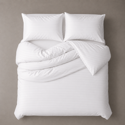 White comforter set with pillows on a beige background