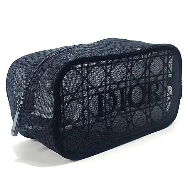 A black Dior mesh cosmetic pouch with a signature patterned front and a silver zipper pull, shown on a white background.