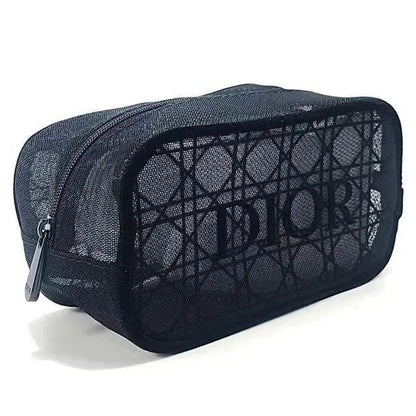 A black Dior mesh cosmetic pouch with a signature patterned front and a silver zipper pull, shown on a white background.