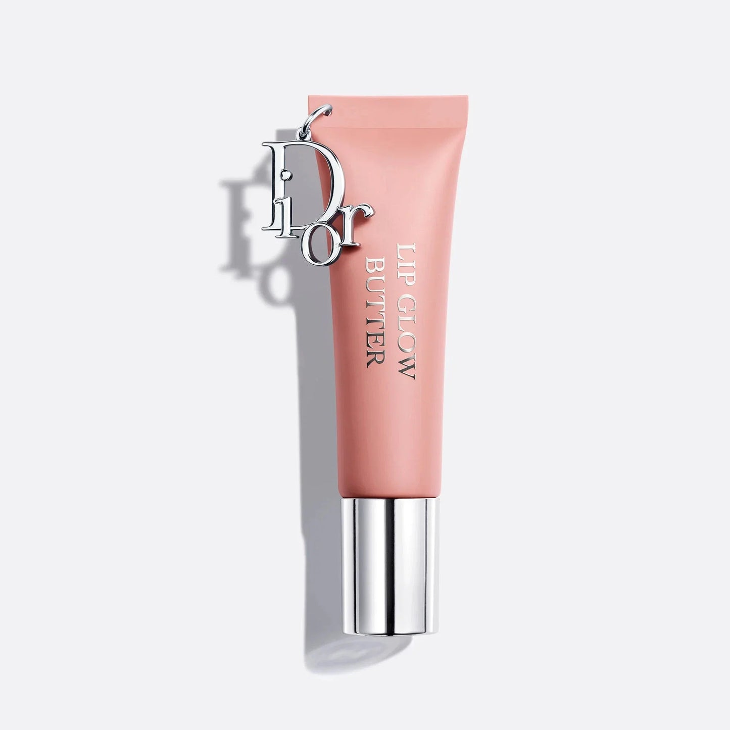 Pink lip balm with silver cap on a white background