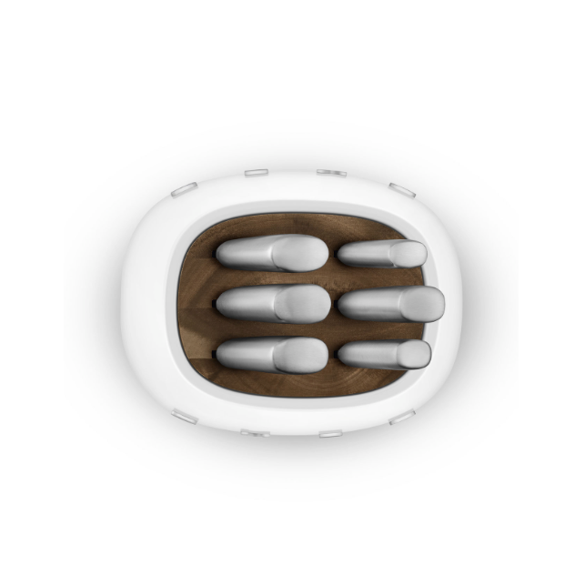 White electronic device with wooden interior and metallic components on a white background