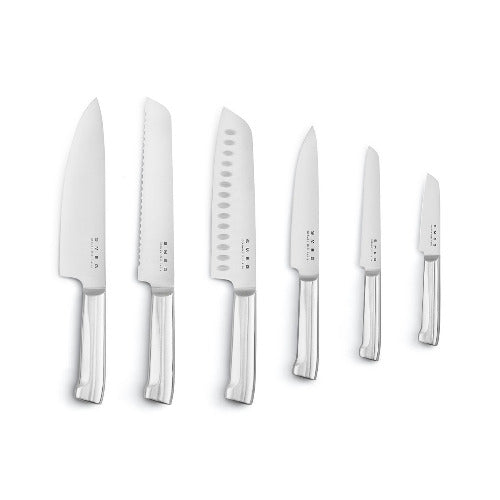Set of six knives with silver handles on a white background