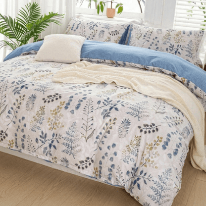 King size 6 piece bedding set, featuring a beautiful blue leaf design.